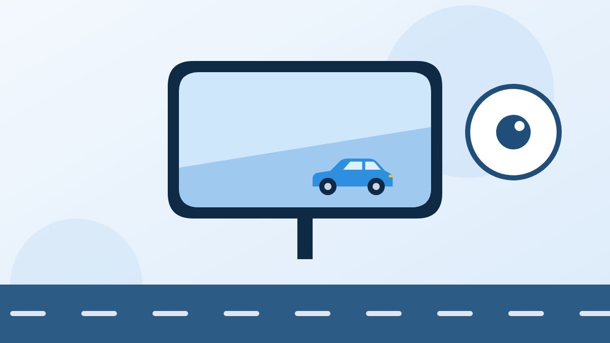 Binnenspiegel met een auto erin en een oog als symbool voor goed kijken
