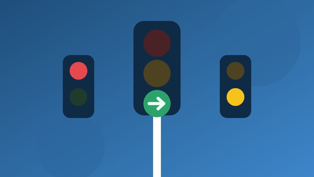 Verkeerslichten met een groene pijl, een rood licht en een geel licht